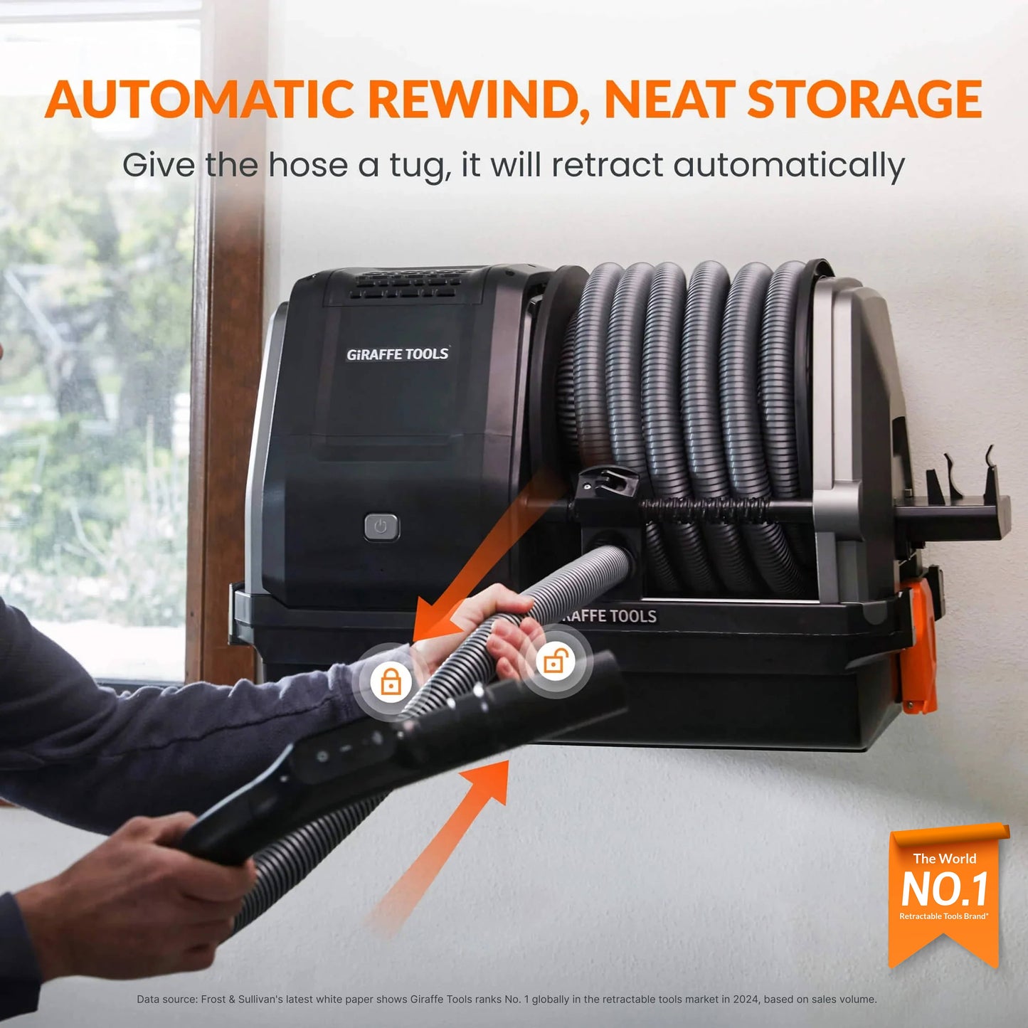 Giraffe Tools US Grandstorm Retractable Garage Vacuum cleaner with hose and attachments, mounted in a garage setting