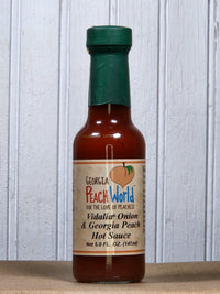 Georgia Peach World Vidalia Onion and Georgia Peach hot sauce bottle, ideal for BBQ and adding flavorful heat to dishes.