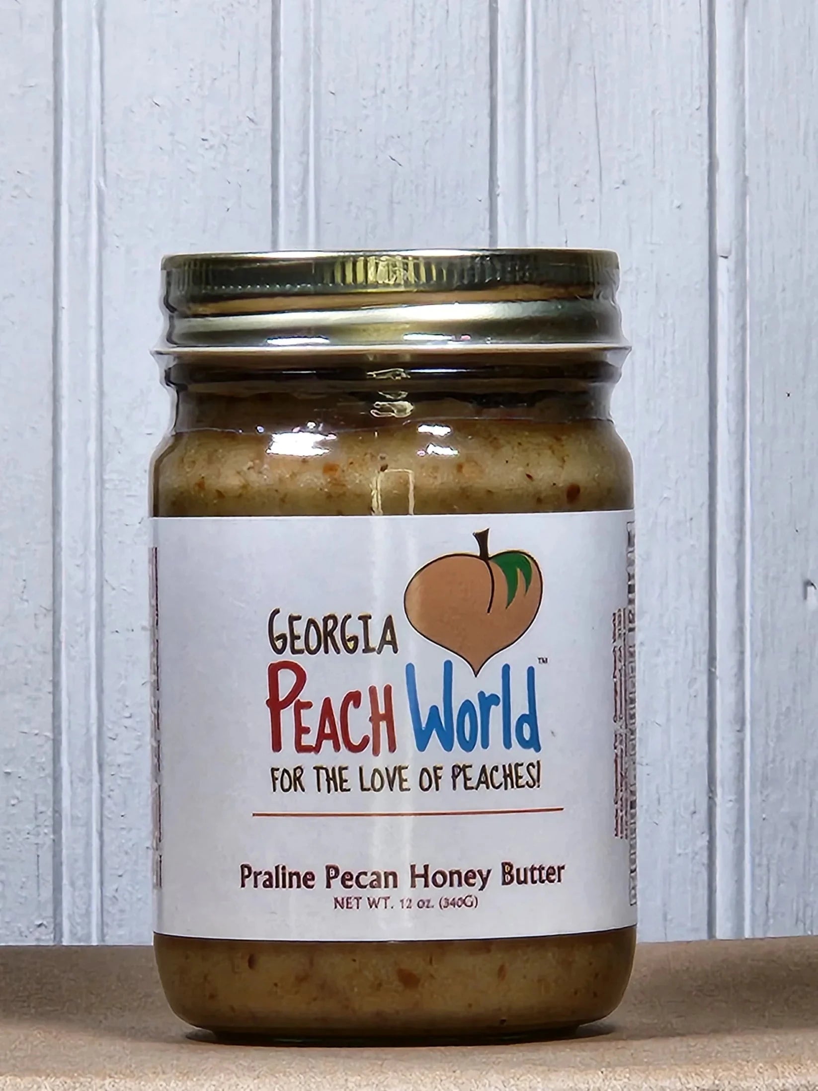 Georgia Peach World pecan honey butter spread in various flavors, creamy and rich, perfect for spreading on bread or toast.