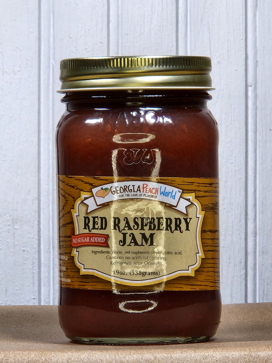 Jar of Georgia Peach World Red Raspberry Jam with no sugar added, showcasing vibrant red raspberry spread in a glass jar.