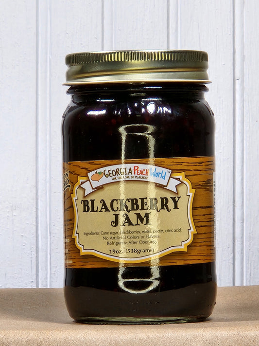 Blackberry jam jar from Georgia Peach World with a label featuring ripe blackberries and a traditional glass jar.