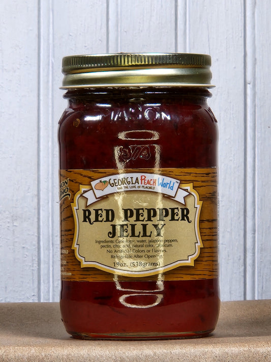 Hot jalapeno pepper jelly jam by Georgia Peach World, showcasing a vibrant, spicy jelly in a clear jar with peppers visible inside.