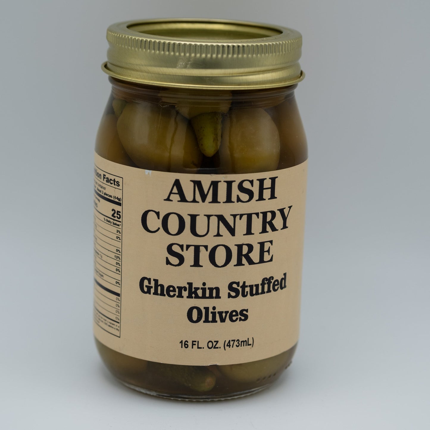 Canned Gherkin Stuffed Olives in 16oz jar from Amish Country Store, showcasing green olives filled with flavor in a clear can.