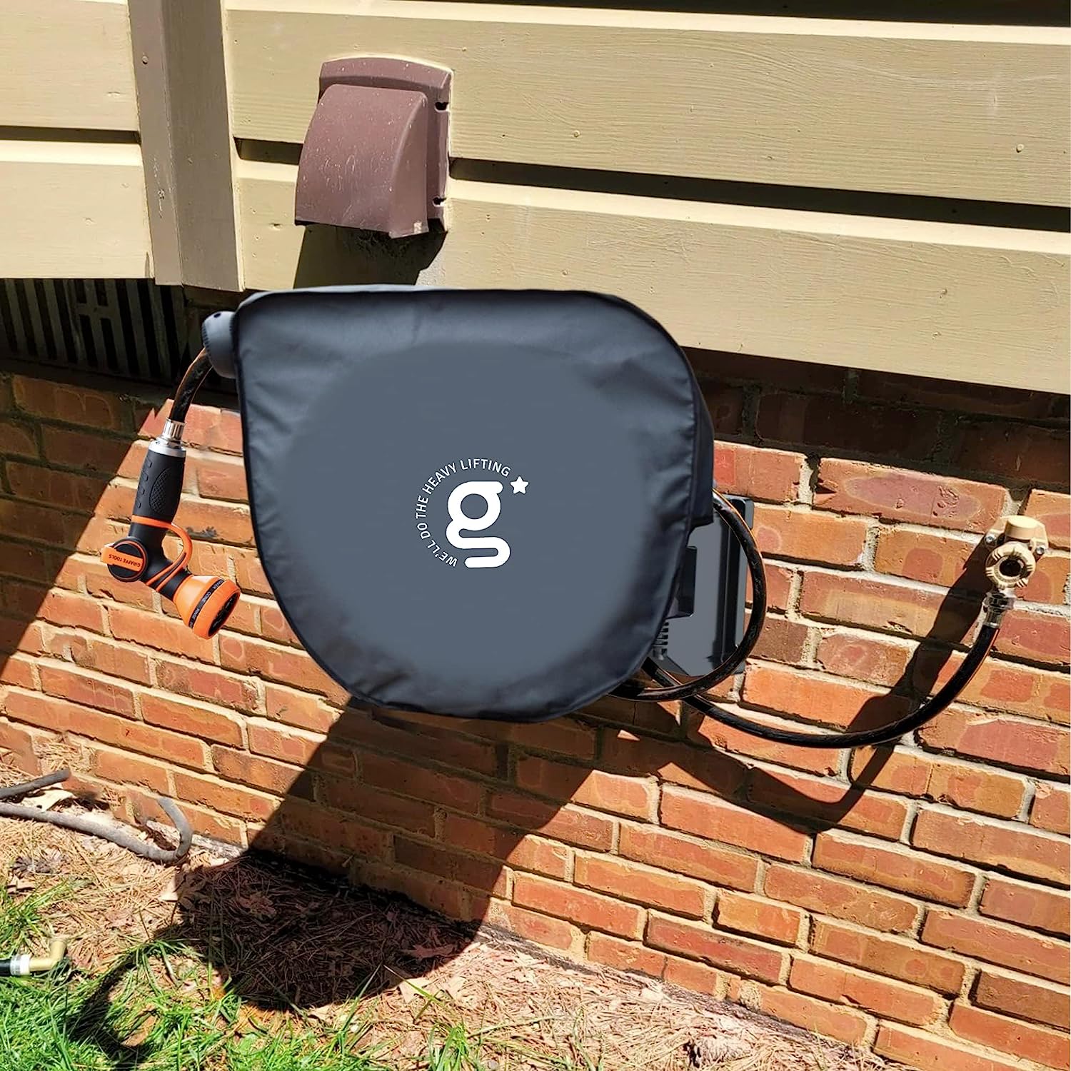 Giraffe Tools US gardening hose reel cover protecting a 90-ft retractable garden hose reel outdoors.