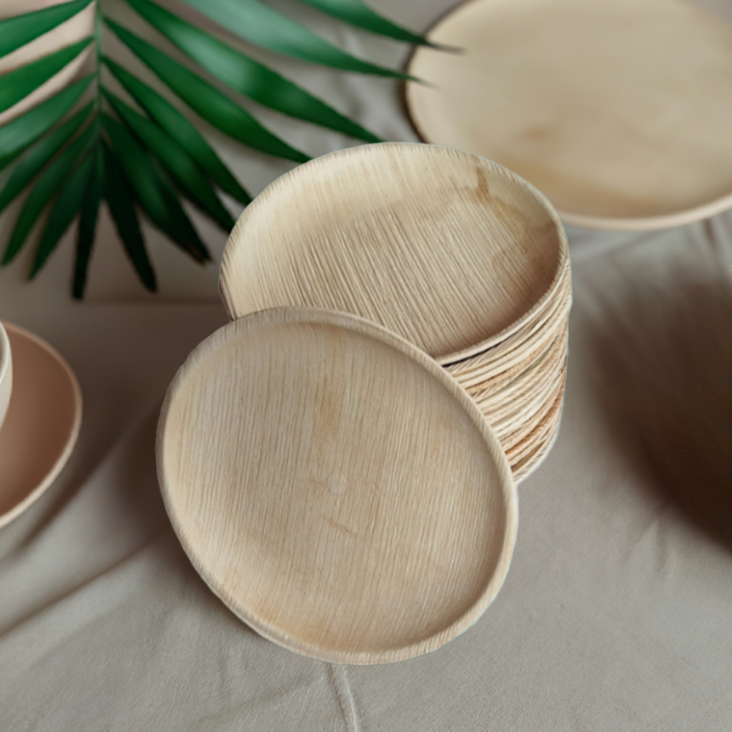 Set of 9-inch round palm leaf plates from MicRic, shown stacked and ready for serving at a gathering, eco-friendly tableware.