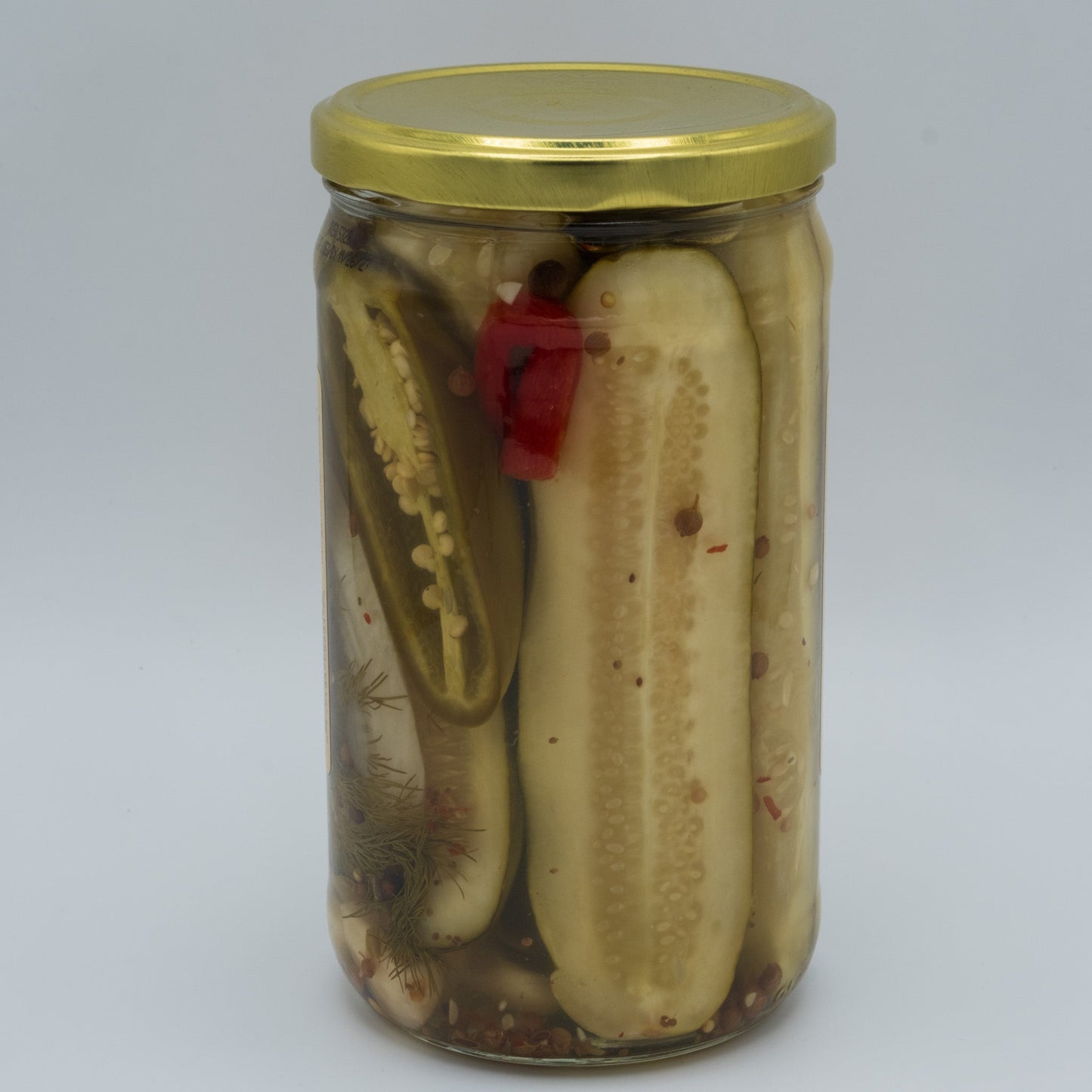 Canned Granny's Hot Sweet Pickles in 24oz jar by Amish Country Store, showing bright, spicy pickles inside clear glass.