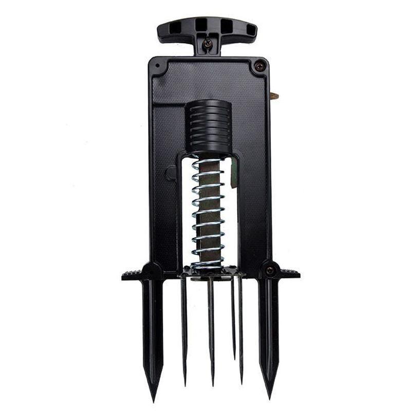 Victor Deadset Mole Trap from Grow Organic pest control set up in soil to catch moles in the yard.