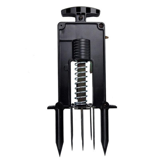 Victor Deadset Mole Trap from Grow Organic pest control set up in soil to catch moles in the yard.