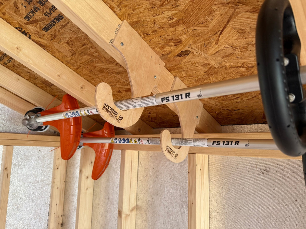Overhead Weed Wacker Rack by HangThis Up, ceiling mount shed organizer for outdoor garden tools and equipment storage.