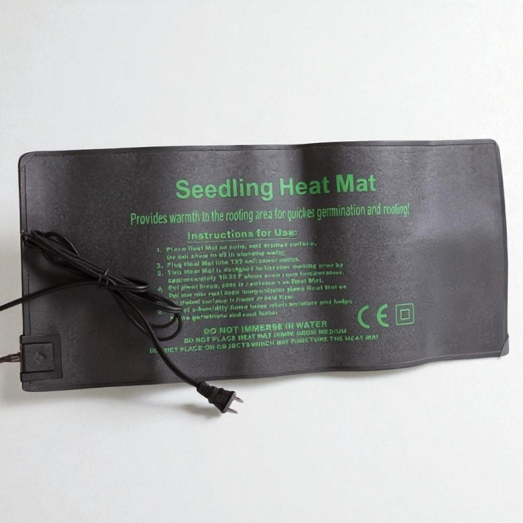 Hasty Roots seedling heat mat for gardening supplies, showing a black heated mat designed to promote plant germination and growth.