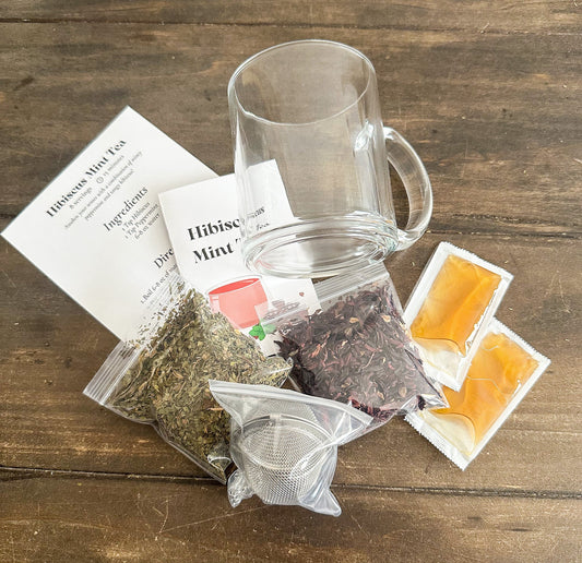 HerbalRoseApothecary hibiscus mint tea gift set with herbal teas in decorative packaging and gift box.