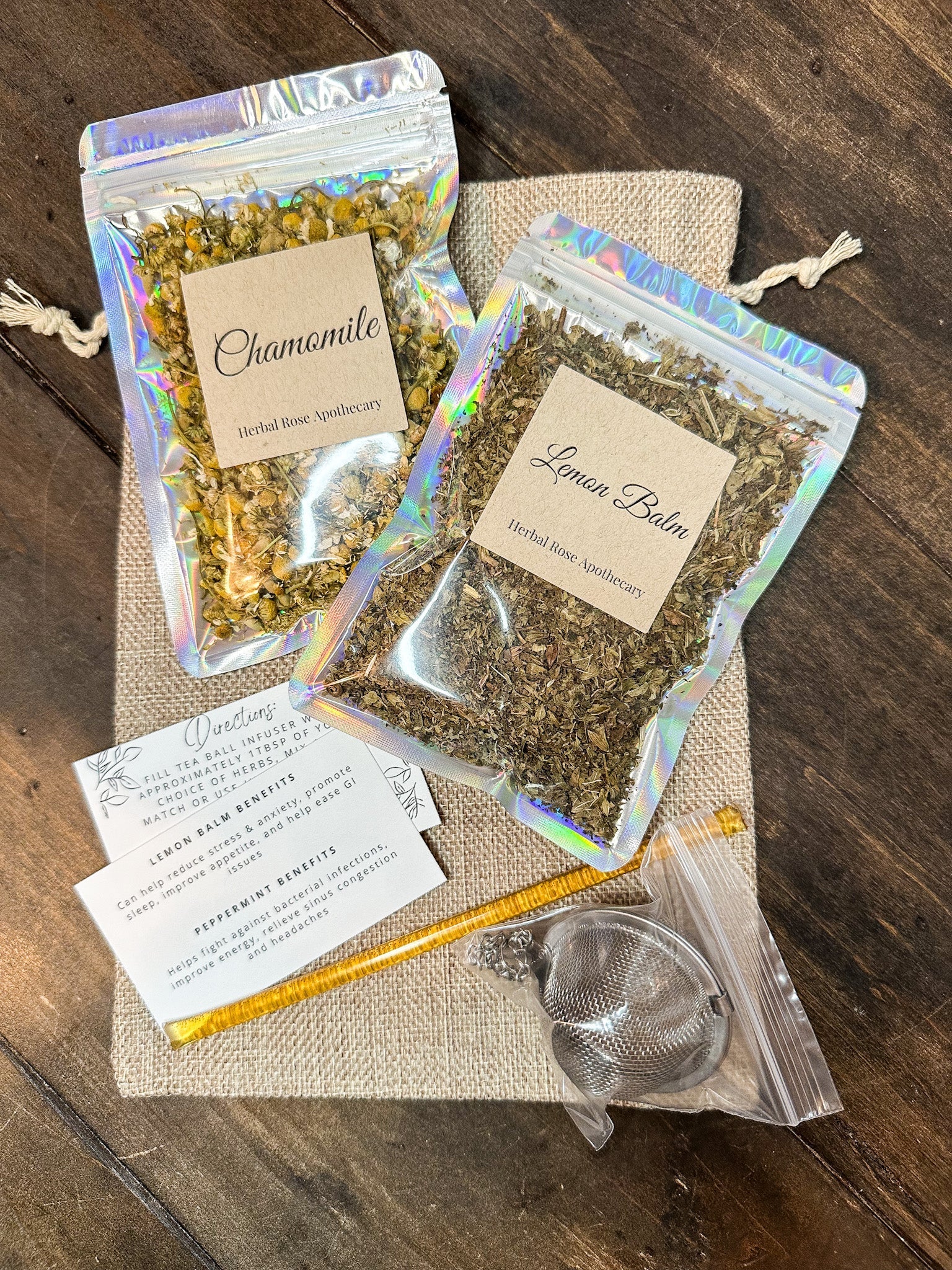 HerbalRoseApothecary herbal tea gift bags featuring peppermint and lemon balm, displayed with front cover and herbal tea bags.