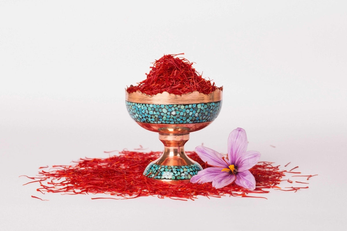 High-quality Saffron Threads from Vanilla Bean Kings, Super Negin grade, displayed in a Tibetan chalice.