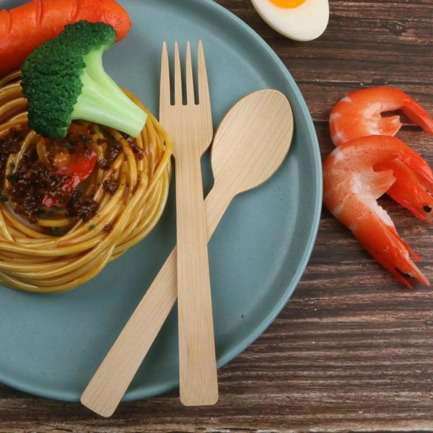Set of 5.5-inch bamboo dessert spoons from Holy City Straw Company, disposable cutlery with natural bamboo finish.
