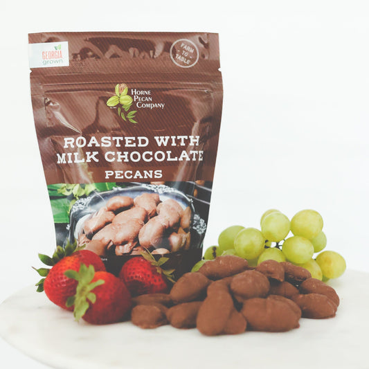 Roasted milk chocolate pecans from Horne Pecan Company, coated with smooth milk chocolate and roasted for flavor.