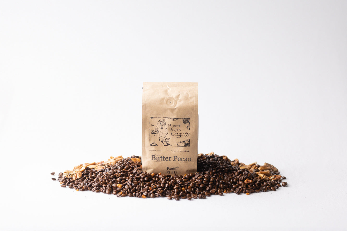 Ground decaf coffee from Horne Pecan Company, 1 lb. Gourmet Pecan Flavored Coffee in a 16 oz. breakfast blend bag.