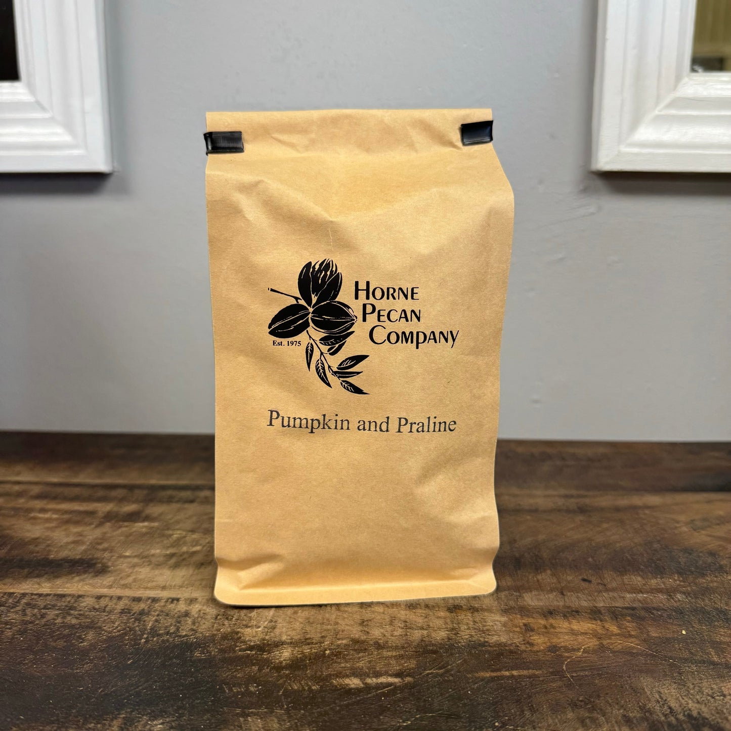 Ground decaf coffee in a 1 lb bag, gourmet pecan flavored, from Horne Pecan Company, with a breakfast blend label.