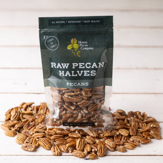Horne Pecan Company fancy Mammoth pecan halves in a 16 oz bag, showcasing large, high-quality nuts for snacking or baking.