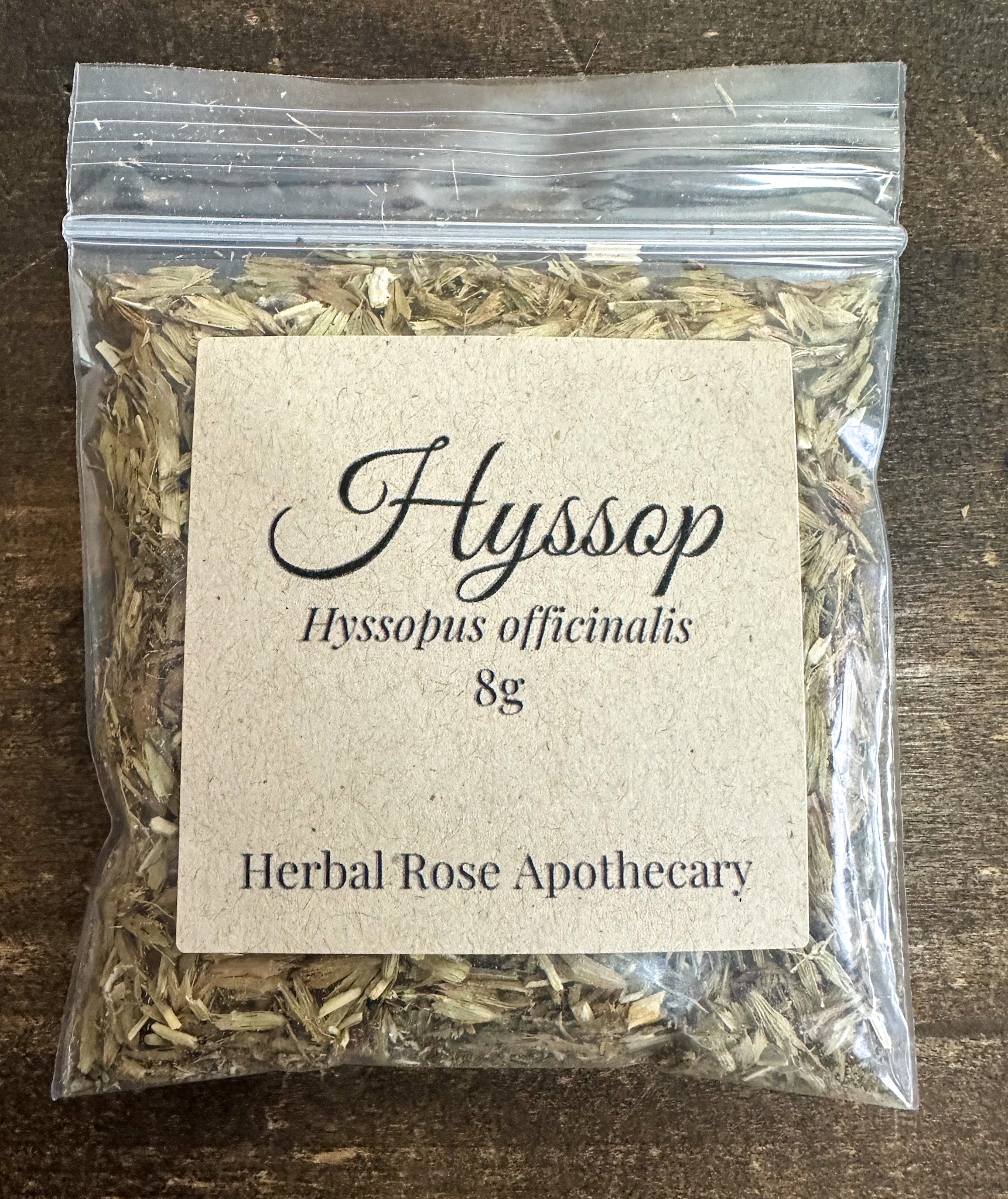 Dried hyssop herbs in an 8g package from HerbalRoseApothecary, showcasing fresh green leaves and delicate stems.