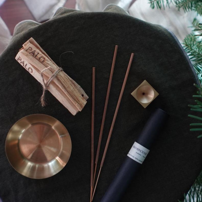 Bundle of Tilley + Me essential oil incense sticks for aromatherapy with matching accessories, displayed in a natural setting.