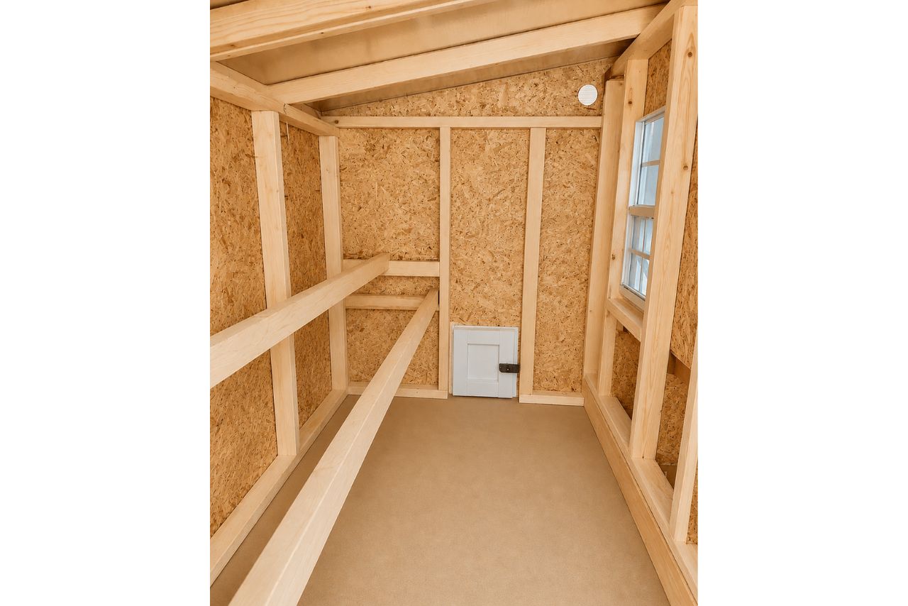 Interior view of the OverEZ large chicken coop designed for up to 15 chickens, featuring spacious nesting and roosting areas.