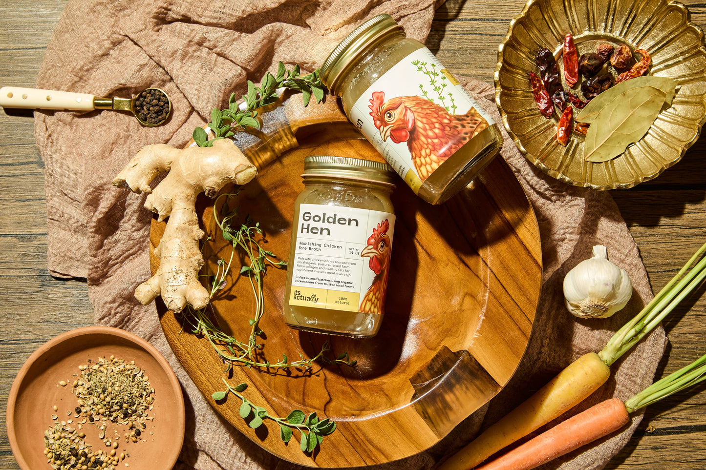 Three 14oz jars of Its Actually Co. Nourishing Halal Chicken Bone Broth beverage with clear labels and transparent lids.