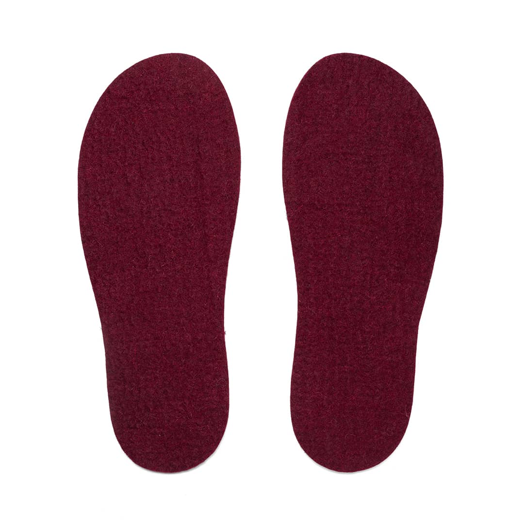 Dark felt insoles by Kyrgies, showing soft, cushioned insoles designed for comfort and warmth in footwear.