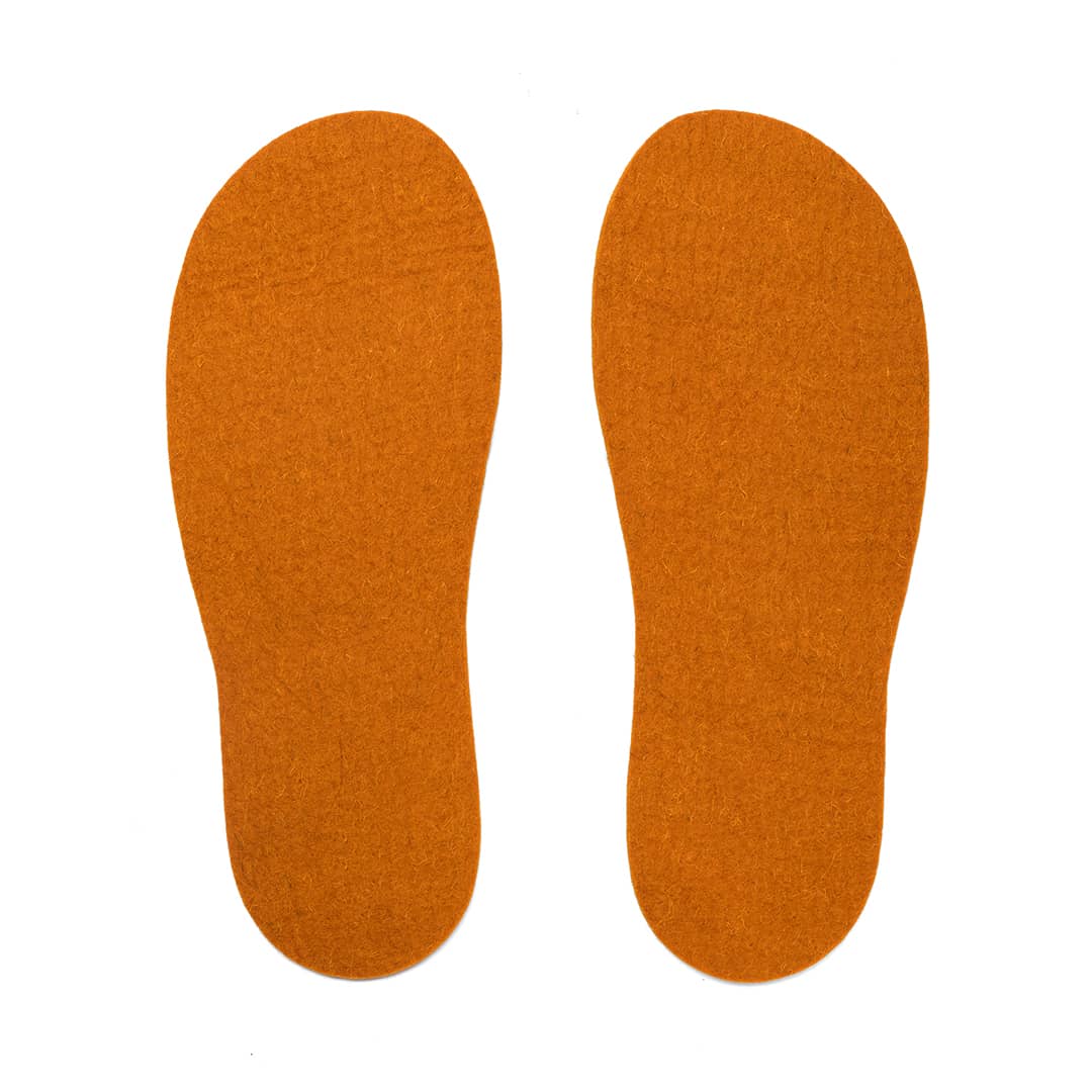 Dark Kyrgies felt insoles for shoes, shown in a close-up image highlighting the soft, plush material and contoured shape.