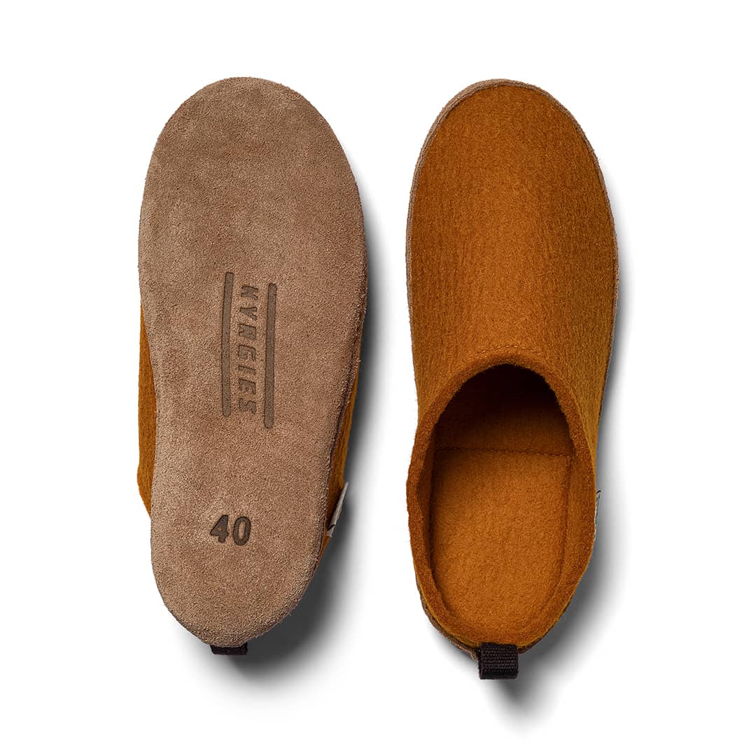 Oatmeal Kyrgies indoor wool slides for women, showcasing soft, cozy slip-on footwear with a rounded toe and plush interior.
