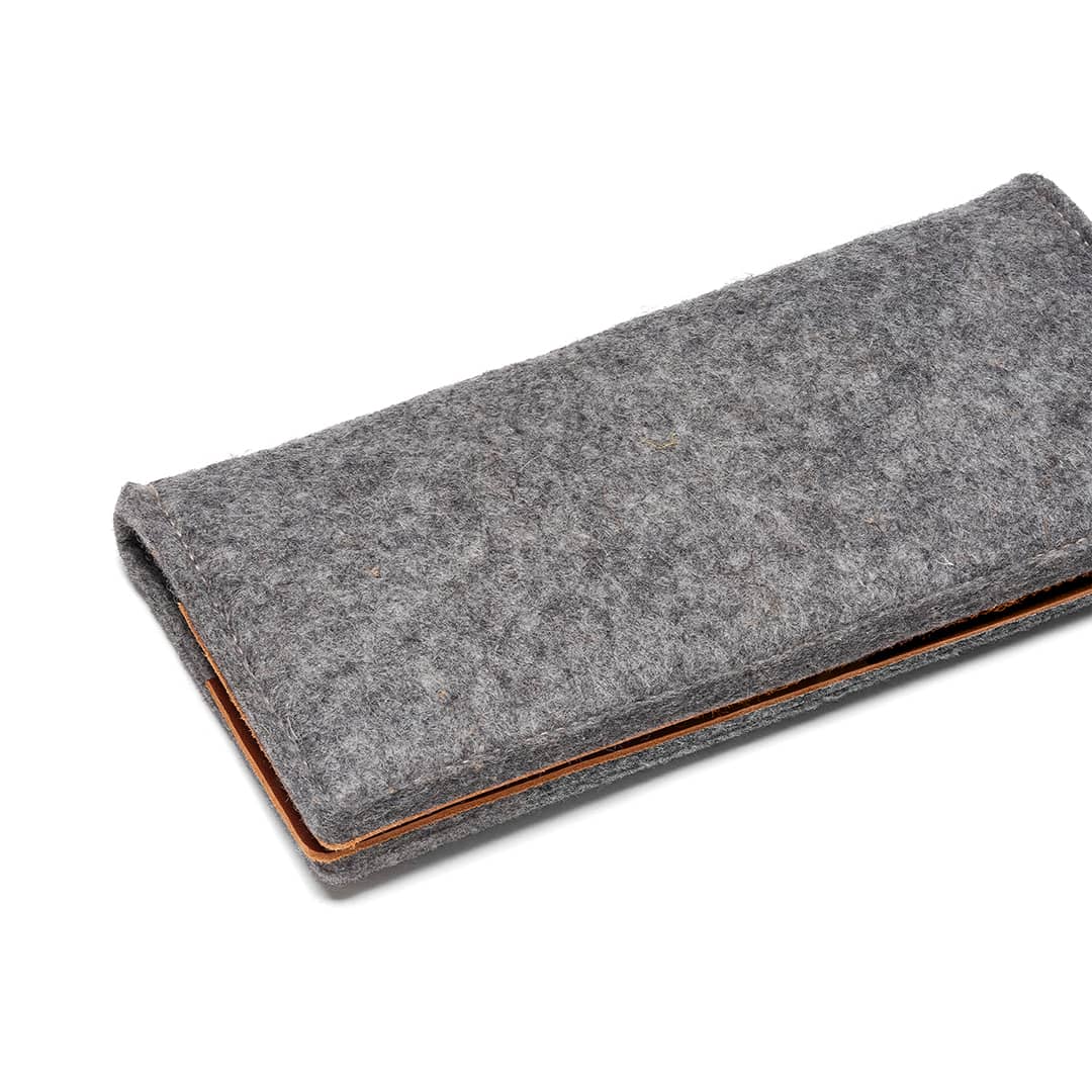 Kyrgies travel wallet made of eco-friendly materials with multiple card slots and a secure zipper closure.