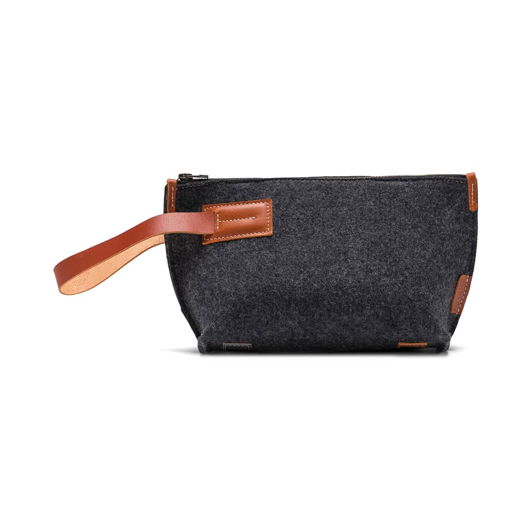 Gray felt and leather Kyrgies travel kit wallet with multiple compartments for organizing essentials.