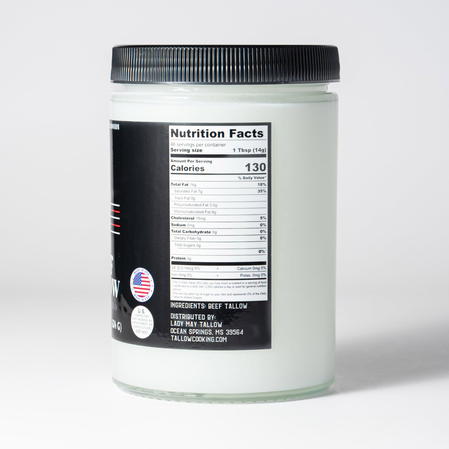 22oz jar of The Lady May grass-fed beef tallow, showing the label and nutrition facts, seed oil-free cooking fat.