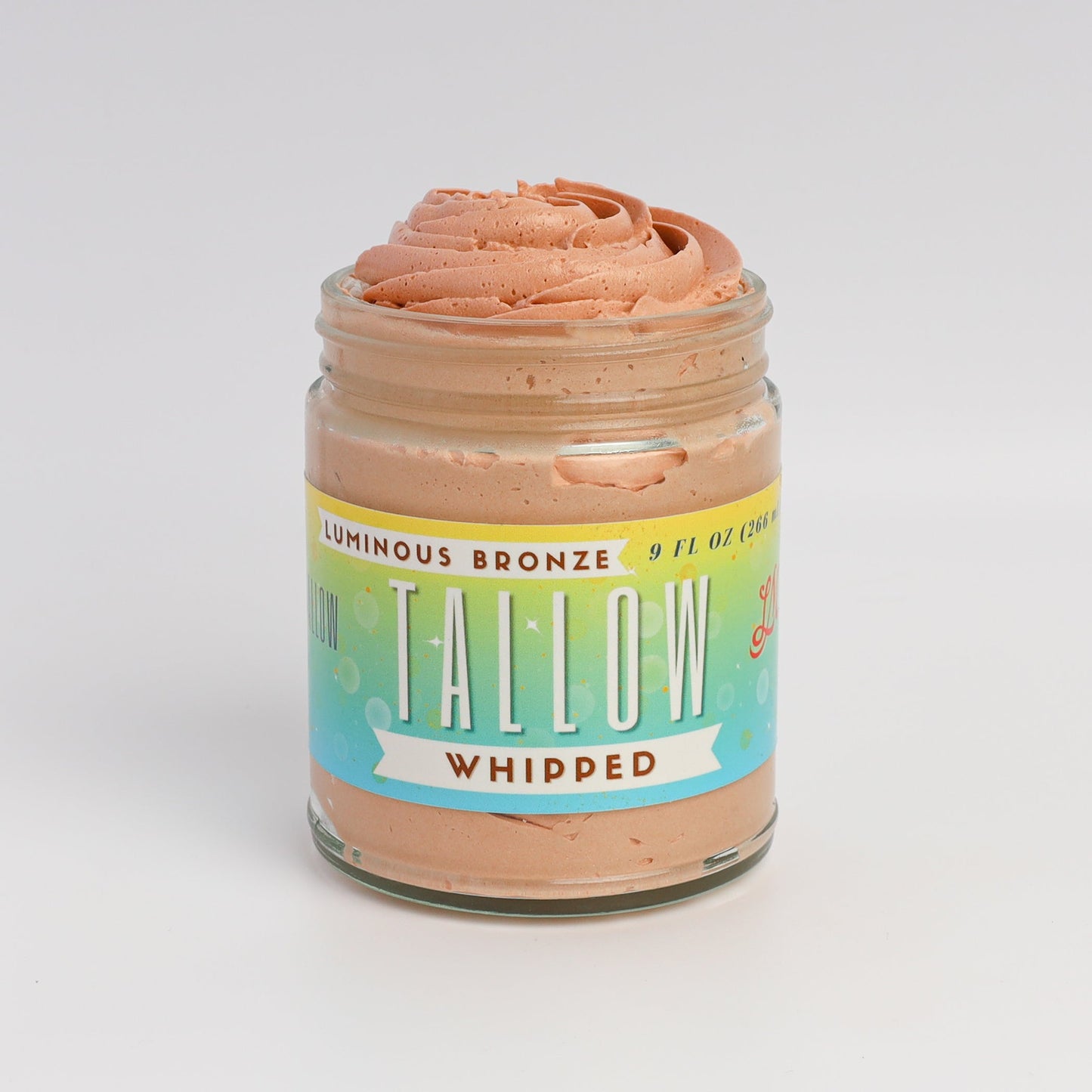 Luminous Bronze Whipped Tallow Moisturizer bronzer in a 9 oz jar, Lady May Tallow body cream with a smooth, glowing finish.