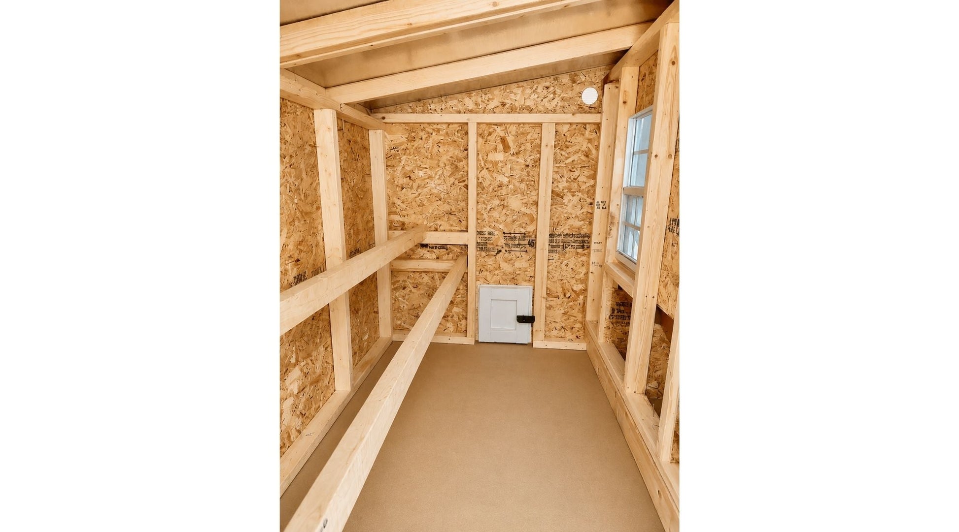 Interior view of the OverEZ large chicken coop designed to house up to 15 chickens, featuring spacious nesting and roosting areas.