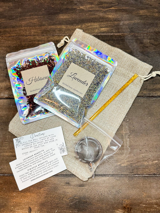 Herbalroseapothecary herbal tea gift bags featuring lavender and hibiscus herbal tea blends in decorative packaging.