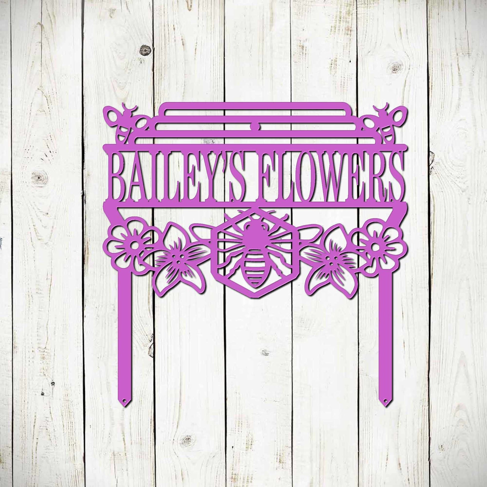 Black metal bee garden stake sign by Lewis Design Company, outdoor patio decor with a honey bee design and garden art style.