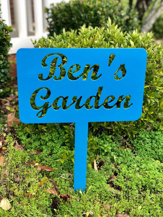 Black custom garden stake sign by Lewis Design Company, outdoor patio and garden art, 15 x 9 inches, suitable for garden decor.
