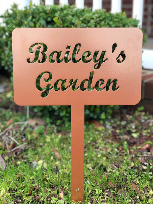 Black custom garden stake sign by Lewis Design Company, outdoor patio and garden art, 15x9 inches, suitable for garden decoration.