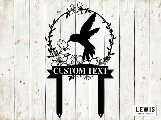 Black metal hummingbird garden stake from Lewis Design Company, outdoor patio and garden art for decorative yard display.