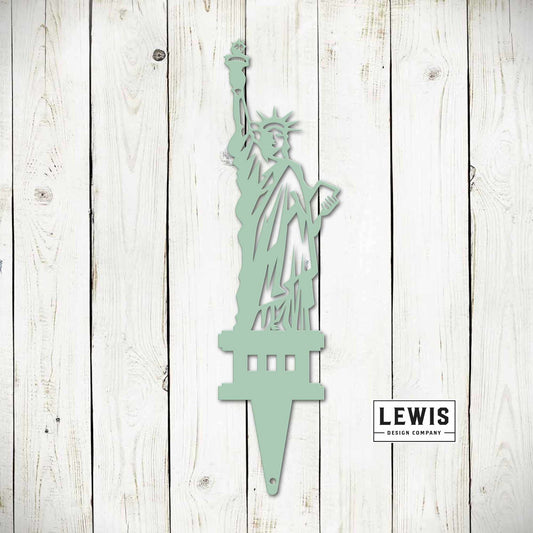Black Statue of Liberty garden stake with patriotic USA design, metal outdoor yard art for 4th of July and garden decor.