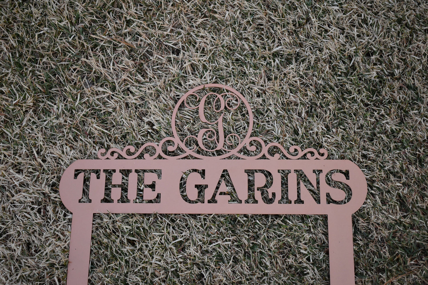 Black Lewis Design Company Monogram Scroll Yard and Garden Sign for outdoor patio and garden decor, 22x19 inches.