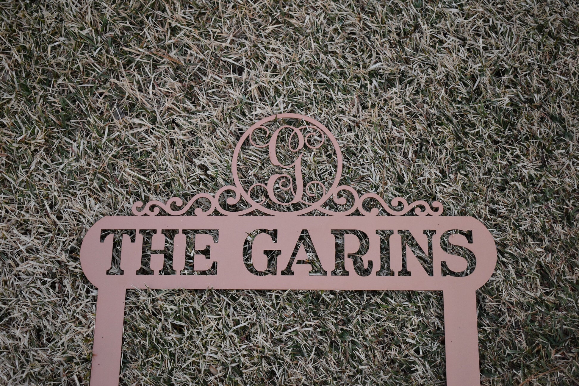 Black Lewis Design Company Monogram Scroll Yard and Garden Sign for outdoor patio and garden decor, 22x19 inches.