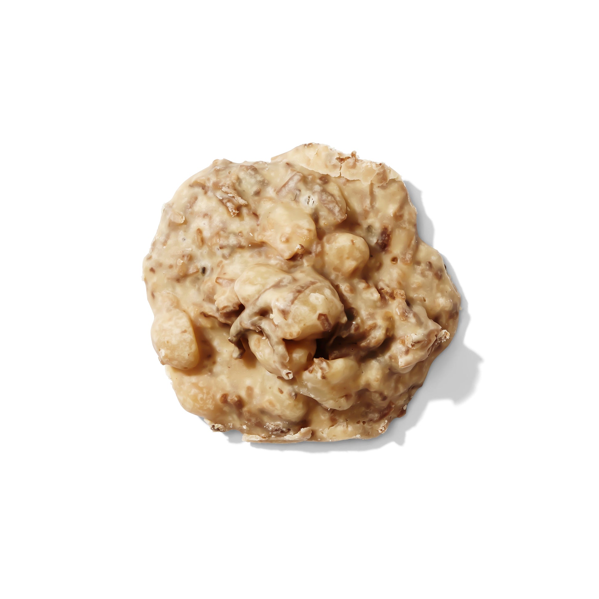 Toasted coconut and macadamia nut pralines from Louisiana Candy Company, showing glossy caramel-coated confections with nuts.