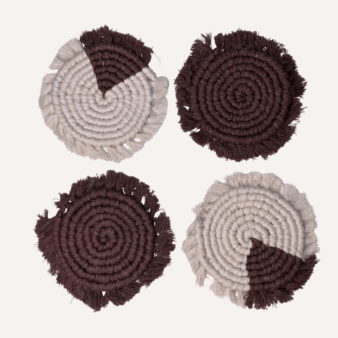 Set of four handmade macrame coasters by Tilley + Me, boho-inspired drink mats for table decor, featuring intricate knotted designs