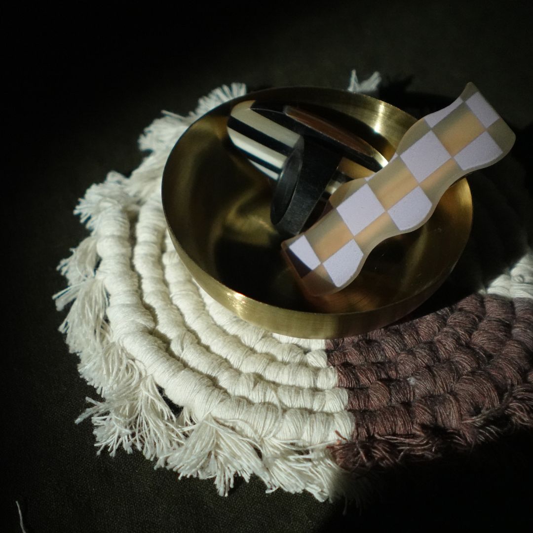 Set of four handmade macrame coasters by Tilley + Me, boho-style table decor with intricate knot patterns for protecting surfaces.