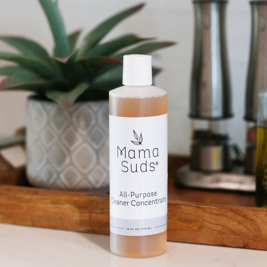 MamaSuds all-purpose cleaner concentrate in a bottle, ideal for household cleaning and versatile for various surfaces.