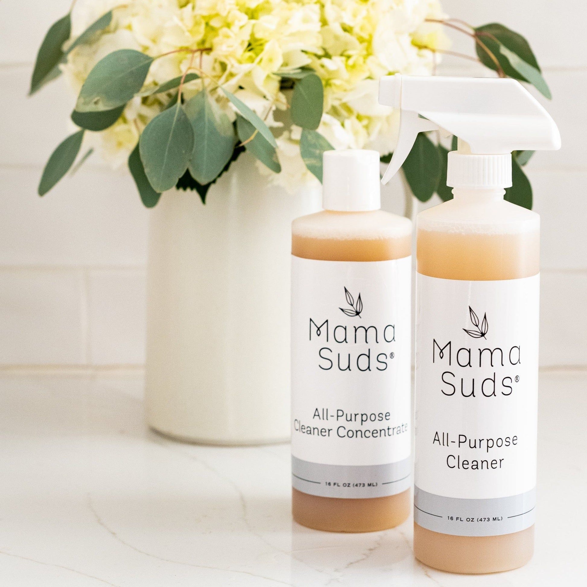 MamaSuds all-purpose cleaner concentrate in a spray bottle, household cleaning product for versatile surface cleaning.