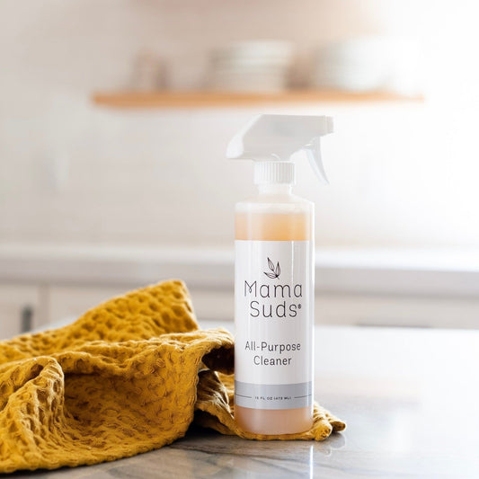 MamaSuds All-Purpose Cleaner Spray in a spray bottle, ideal for household cleaning tasks and surface sanitation.