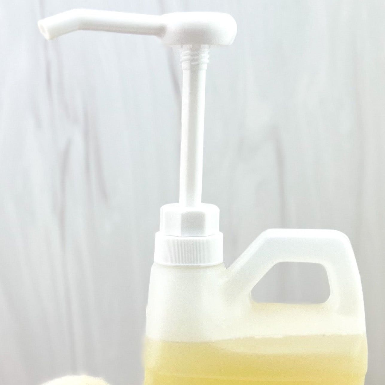 MamaSuds soap dispenser pump for household cleaning, featuring a sleek design and easy-to-use pump mechanism.