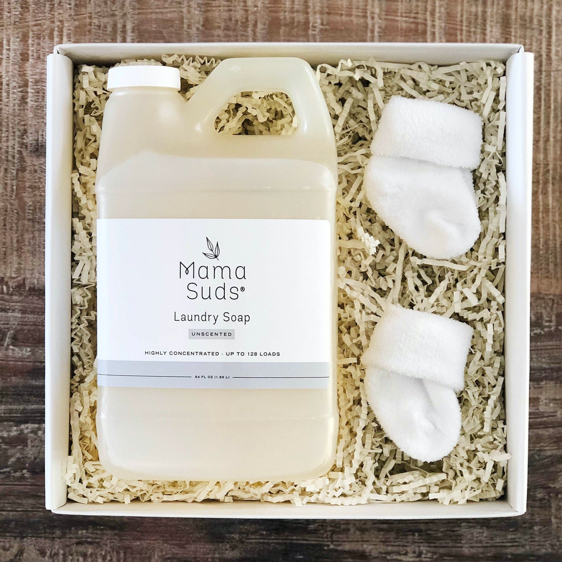 Unlabeled 64-ounce bottle of MamaSuds laundry detergent soap, unscented household cleaning product for effective laundry cleaning.